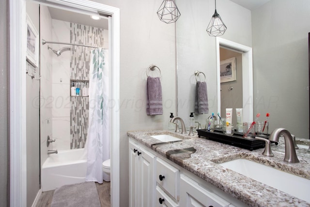 9191 E Strawberry Fields Dr, Canyon, TX 79119 - bathroom with double vanity, toilet, and shower / bath combo with shower curtain