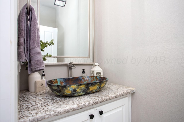 9191 E Strawberry Fields Dr, Canyon, TX 79119 - bathroom with vanity and a textured wall