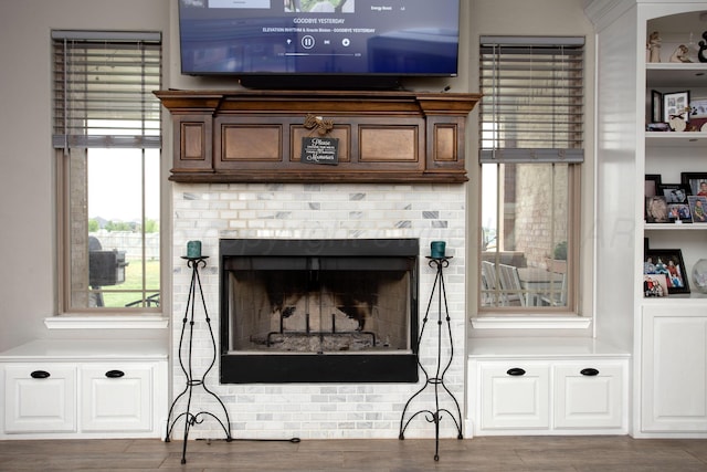 9191 E Strawberry Fields Dr, Canyon, TX 79119 - detailed view of wood finished floors and a brick fireplace