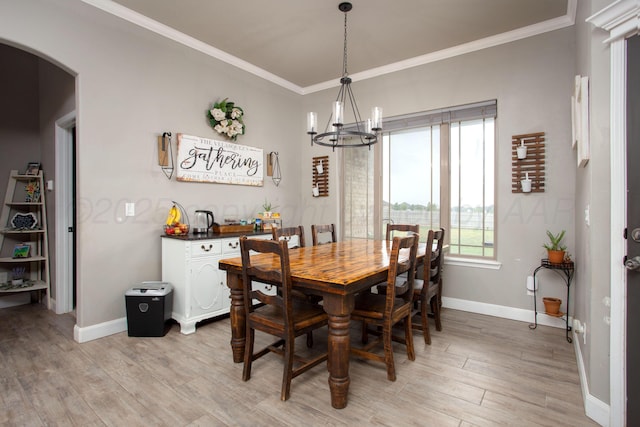 9191 E Strawberry Fields Dr, Canyon, TX 79119 - dining area featuring arched walkways, a chandelier, light wood-style flooring, baseboards, and ornamental molding