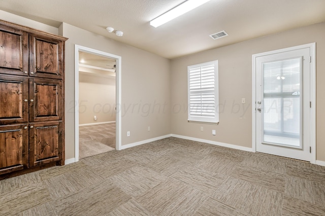7110 Bennett St, Amarillo, TX 79119 - empty room featuring light colored carpet and a smoke detector