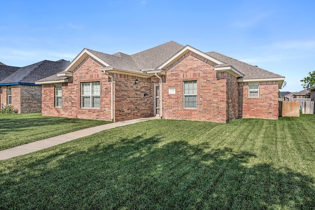 7110 Bennett St, Amarillo, TX 79119 - view of front facade featuring brick siding and roof with shingles