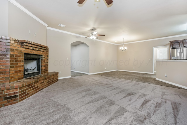 7110 Bennett St, Amarillo, TX 79119 - unfurnished living room featuring ceiling fan, a fireplace, carpet, crown molding, and a chandelier