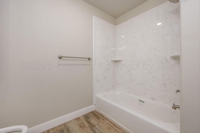 505 Pratt St, Claude, TX 79019 - full bathroom with baseboards,  shower combination, wood finished floors, and toilet