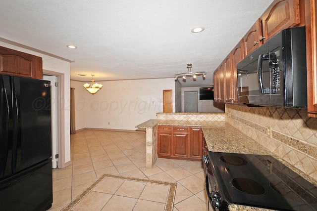5507 Harvard St, Amarillo, TX 79109 - kitchen featuring black appliances, a peninsula, decorative backsplash, light tile patterned flooring, and recessed lighting