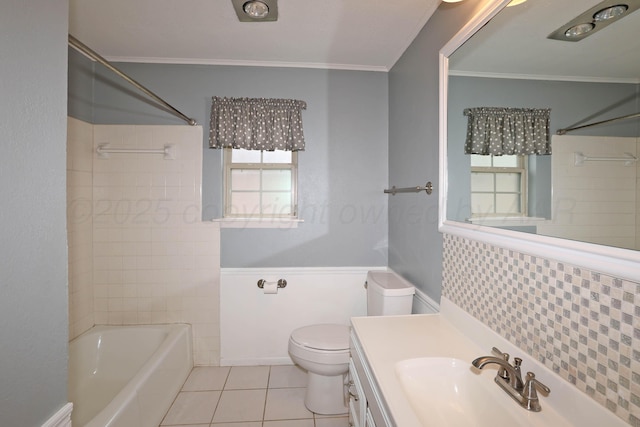 5507 Harvard St, Amarillo, TX 79109 - bathroom with crown molding, toilet, vanity, bathtub / shower combination, and tile patterned flooring