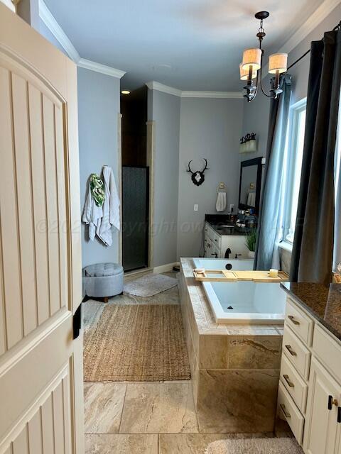 4301 Fairway Dr, Amarillo, TX 79124 - full bath featuring a chandelier, a stall shower, crown molding, a garden tub, and vanity