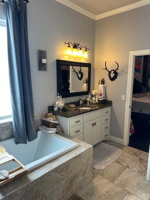 full bathroom featuring crown molding, tiled bath, a wealth of natural light, and vanity