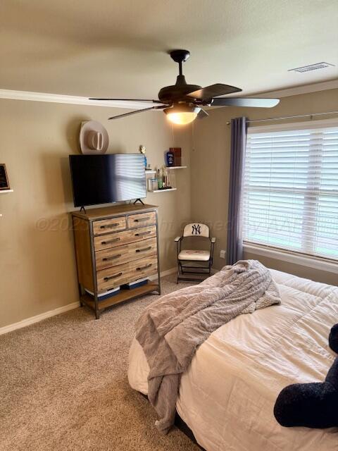 4301 Fairway Dr, Amarillo, TX 79124 - carpeted bedroom featuring ornamental molding, baseboards, and a ceiling fan