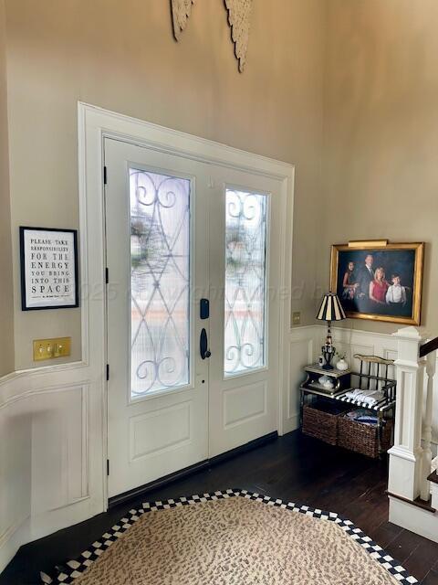 4301 Fairway Dr, Amarillo, TX 79124 - foyer with french doors, wood finished floors, and wainscoting