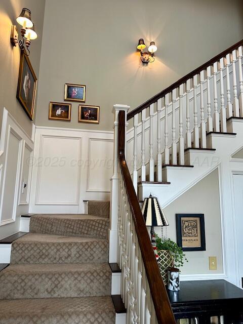 4301 Fairway Dr, Amarillo, TX 79124 - stairway featuring a decorative wall and wainscoting