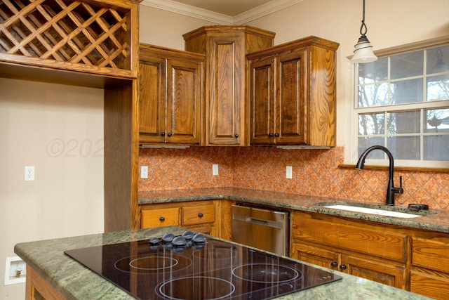 kitchen featuring backsplash, crown molding, and sink