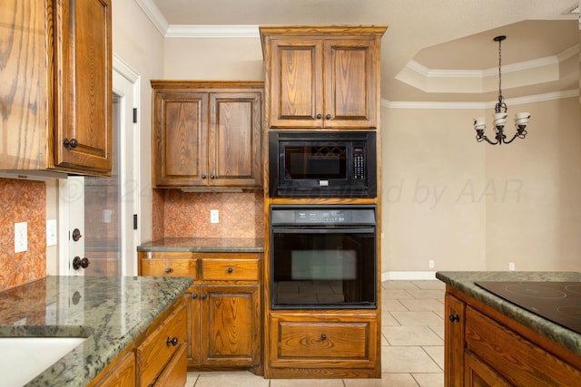 kitchen with an inviting chandelier, black appliances, dark stone countertops, tasteful backsplash, and light tile patterned flooring