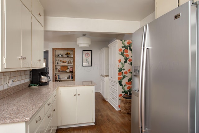 3412 Lenwood Dr, Amarillo, TX 79109 - kitchen featuring stainless steel fridge with ice dispenser, a peninsula, dark wood-style floors, and white cabinets
