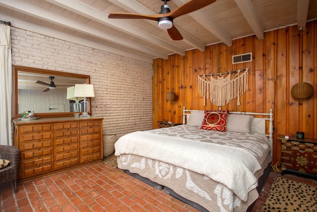 3412 Lenwood Dr, Amarillo, TX 79109 - bedroom with a wood ceiling with exposed beams, brick flooring, and wood walls