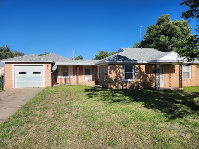 1002 N Spring St, Amarillo, TX 79107 - ranch-style home with an attached garage, brick siding, a front lawn, driveway, and a porch