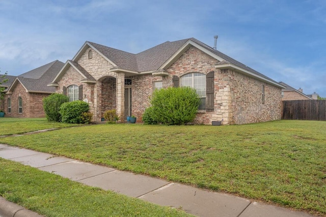 8313 Irvington Ct, Amarillo, TX 79119 - french country inspired facade featuring brick siding and roof with shingles