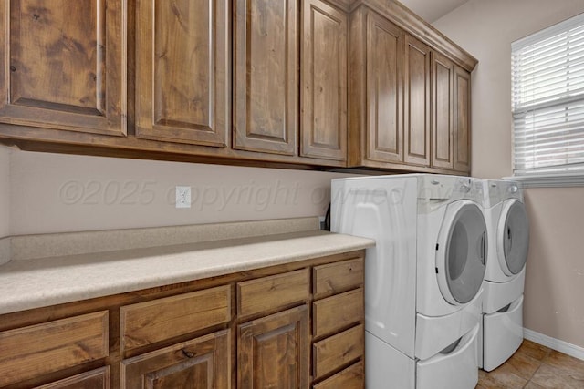 8313 Irvington Ct, Amarillo, TX 79119 - laundry area with washing machine and clothes dryer, cabinet space, and baseboards