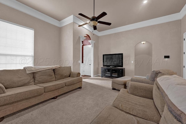 8313 Irvington Ct, Amarillo, TX 79119 - living area featuring arched walkways, ornamental molding, a ceiling fan, carpet, and baseboards