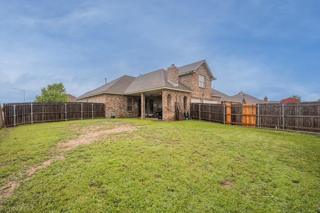 8313 Irvington Ct, Amarillo, TX 79119 - rear view of house with brick siding and a chimney