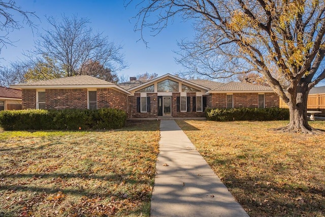 4204 Roxton Dr, Amarillo, TX 79109 - view of front of property featuring a front lawn, brick siding, and a chimney