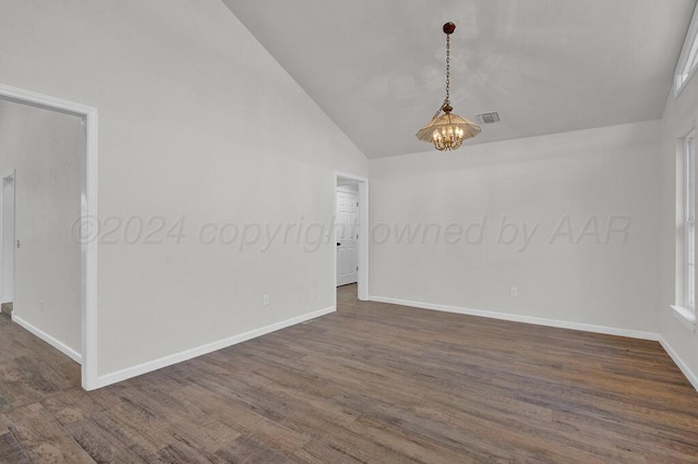 4204 Roxton Dr, Amarillo, TX 79109 - unfurnished room featuring vaulted ceiling, dark wood-style floors, and a chandelier
