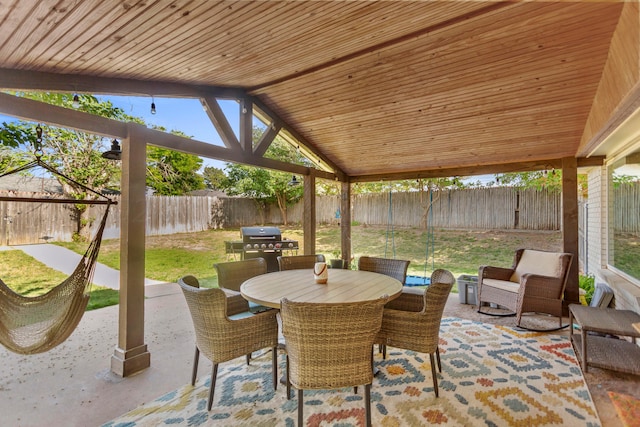 sunroom / solarium with lofted ceiling and wood ceiling