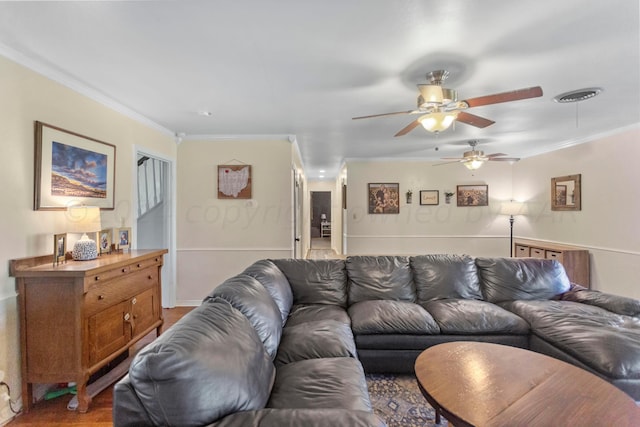 living room featuring ornamental molding, hardwood / wood-style floors, and ceiling fan