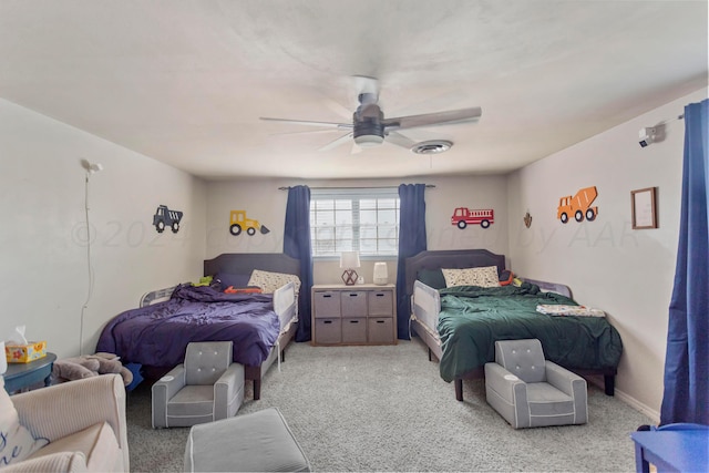 bedroom featuring light carpet and ceiling fan