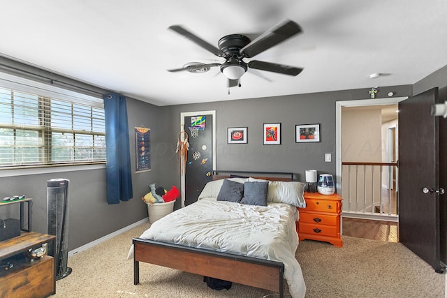 bedroom with light carpet and ceiling fan