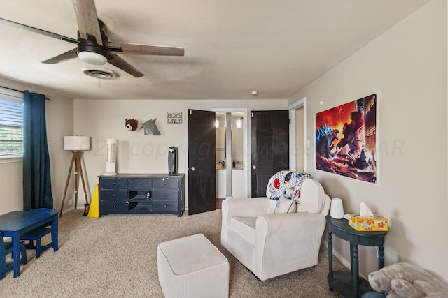 living room with carpet and ceiling fan