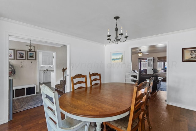 dining room with dark hardwood / wood-style flooring, ornamental molding, and ceiling fan with notable chandelier