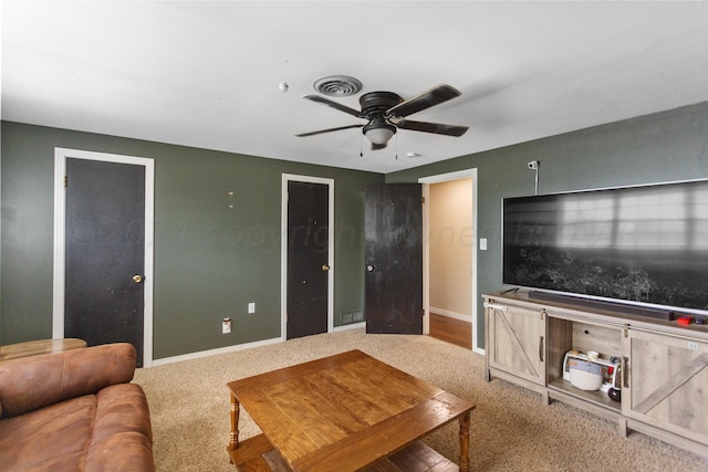 living room featuring carpet floors and ceiling fan