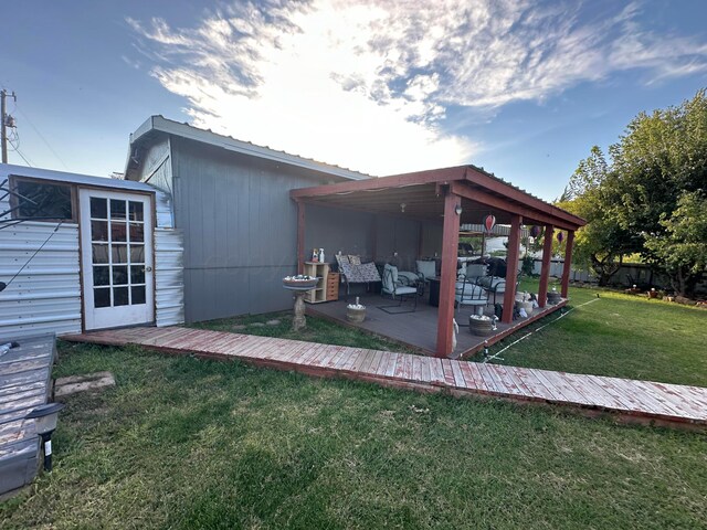 exterior space featuring a yard and an outdoor hangout area