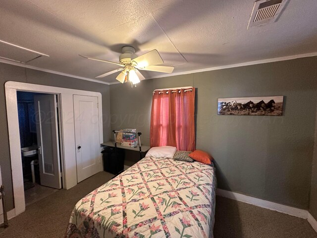 carpeted bedroom with ceiling fan, a textured ceiling, connected bathroom, and crown molding