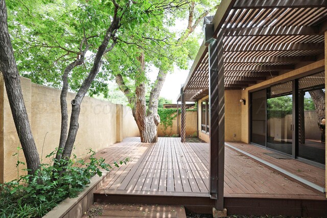 6 Woodstone St, Amarillo, TX 79106 - deck featuring a fenced backyard and a pergola