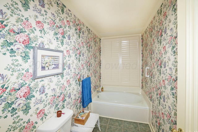 6 Woodstone St, Amarillo, TX 79106 - bathroom featuring wallpapered walls, a bath, toilet, baseboards, and tile patterned flooring