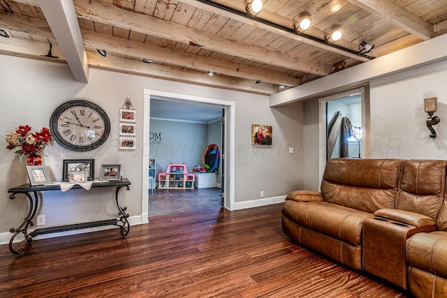 living room featuring dark wood-style floors, wooden ceiling, baseboards, and beam ceiling