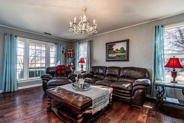 living room featuring a healthy amount of sunlight, visible vents, dark wood finished floors, and ornamental molding