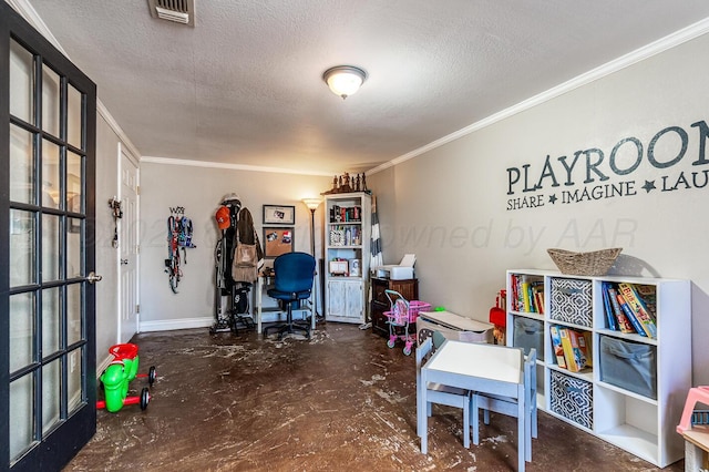 rec room featuring a textured ceiling, visible vents, concrete flooring, and ornamental molding