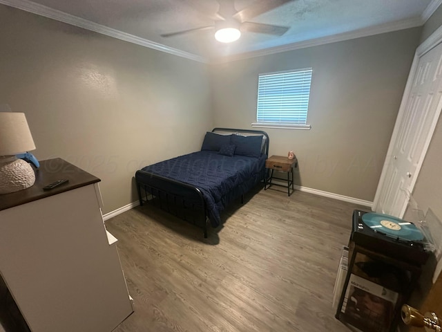 313 Mustang St, Fritch, TX 79036 - bedroom with ornamental molding, wood finished floors, and ceiling fan