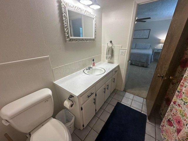 313 Mustang St, Fritch, TX 79036 - full bath featuring ensuite bath, vanity, tile patterned flooring, and backsplash