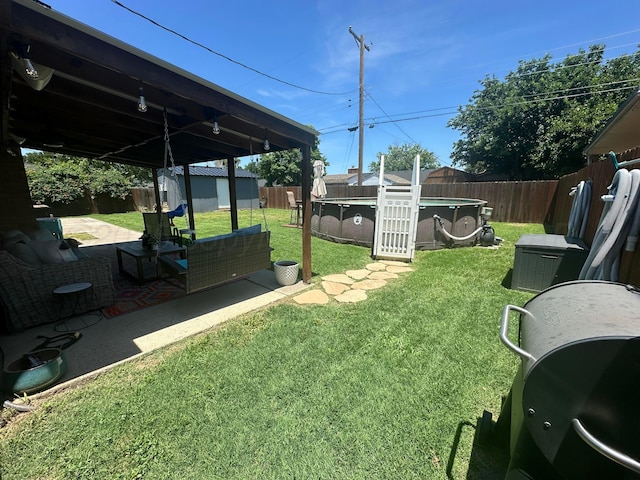 313 Mustang St, Fritch, TX 79036 - fenced backyard with a storage shed and a patio