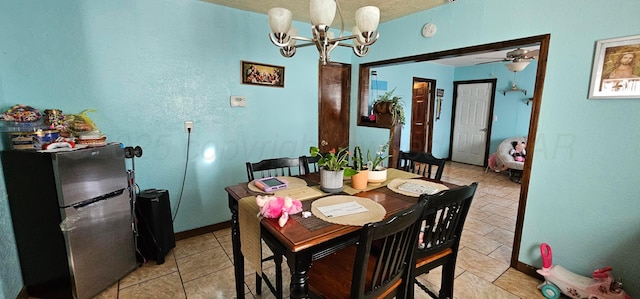 dining room featuring ceiling fan with notable chandelier