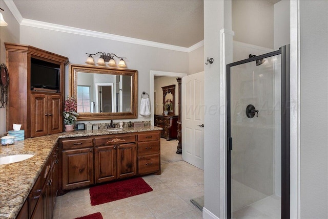 7808 Pineridge Dr, Amarillo, TX 79119 - full bathroom with a shower stall, double vanity, ornamental molding, and tile patterned flooring