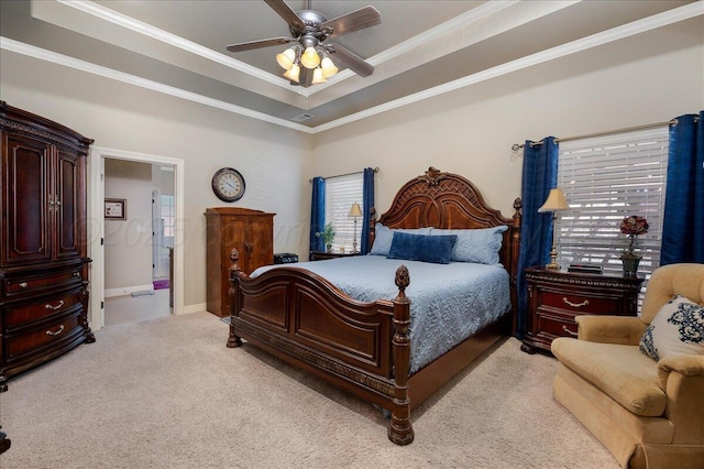 7808 Pineridge Dr, Amarillo, TX 79119 - bedroom featuring light colored carpet, a tray ceiling, crown molding, and ceiling fan