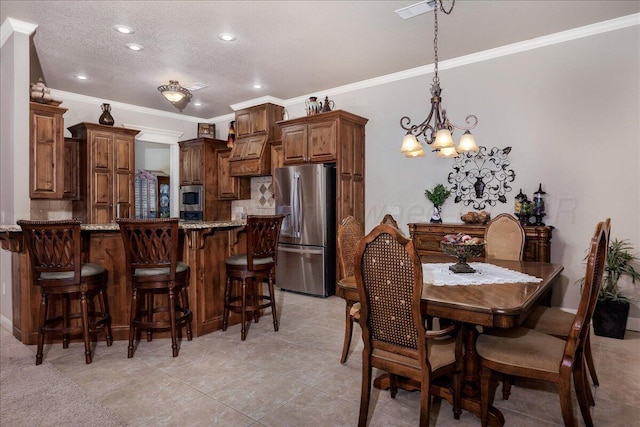 7808 Pineridge Dr, Amarillo, TX 79119 - dining area with a chandelier, ornamental molding, a textured ceiling, recessed lighting, and light tile patterned flooring