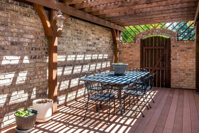 7808 Pineridge Dr, Amarillo, TX 79119 - deck with outdoor dining space, a pergola, and a gate