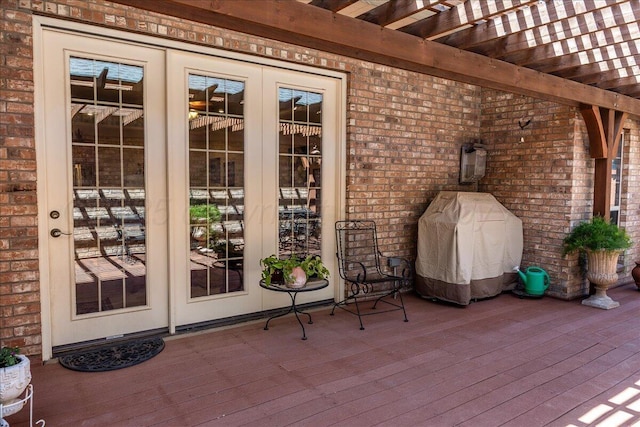 7808 Pineridge Dr, Amarillo, TX 79119 - wooden terrace with french doors, a pergola, and a grill