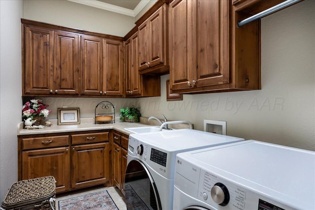 7808 Pineridge Dr, Amarillo, TX 79119 - laundry room featuring independent washer and dryer, cabinet space, and ornamental molding
